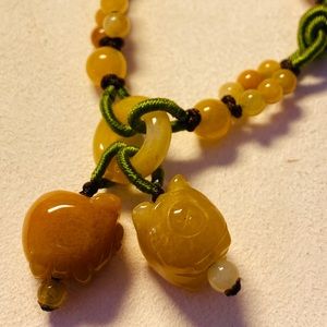 Hand carved Piggies jade and hand knitted bracelet